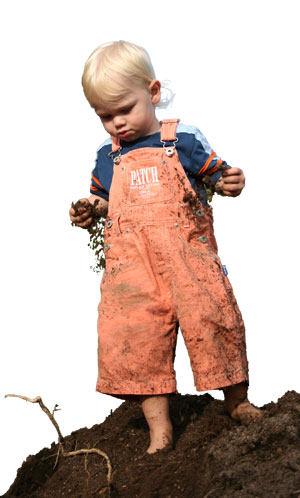 photo of kids playing in the mud