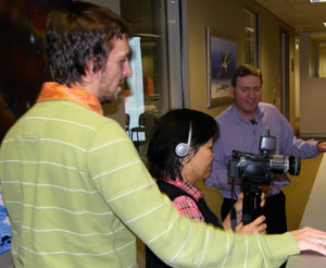 CMI’s Jason Jamieson gives Mrs Esther Catchpoole some tips on using a home video camera.