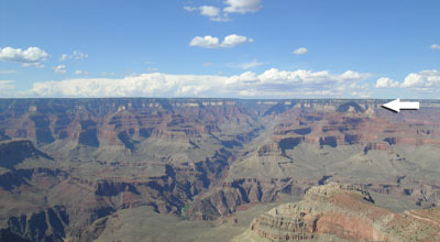 Grand Canyon is one of the best places in the world to see over 1,200 m of rapidly deposited Flood layers over a large area. Because of shifting and slowing currents, and particles of different mass, shape and density, layers formed quickly. Arrow shows the Coconino Sandstone near the top. 