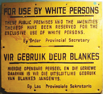 A typical sign of the apartheid era in a South African public space, probably a Durban beach.