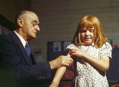 doctor performing a typhoid vaccination in Texas, 1943